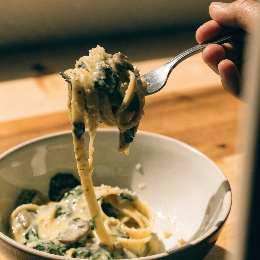 Close-up of creamy parmesan spinach mushroom pasta