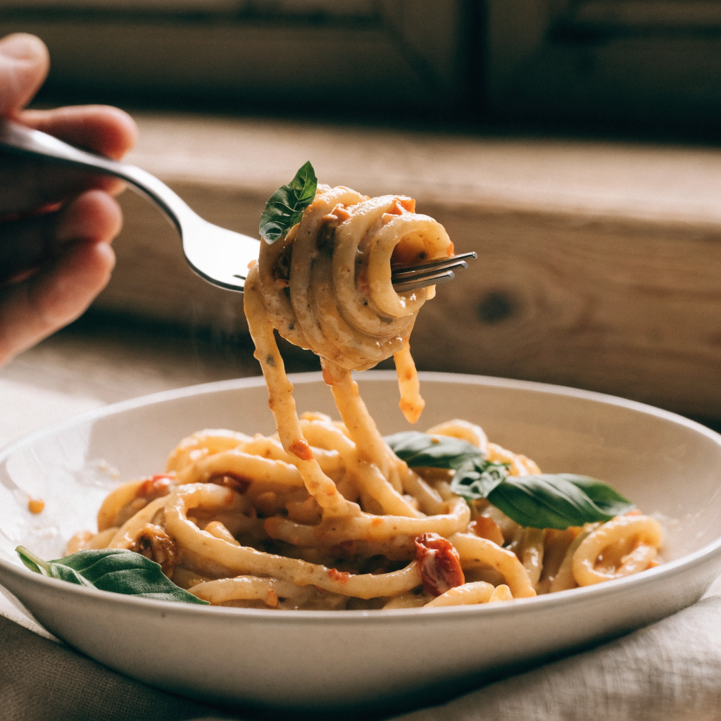 Close-up of creamy sun-dried tomato vegan pasta