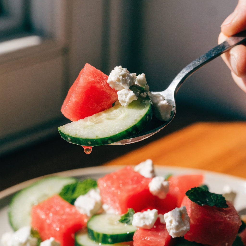 Close-up of fresh watermelon salad with feta, cucumber, and mint